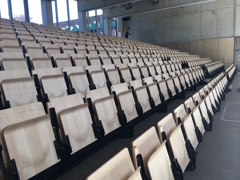 Retractable grandstand with fully automatically operated chairs in auditorium Don Bosco in Haacht.