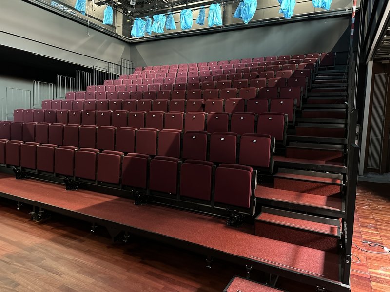The new retractable grandstand in Studio Boekman in Dutch National Opera and Ballet in Amsterdam. Operated with rigid chain system, chairs are set up and fold down automatically.