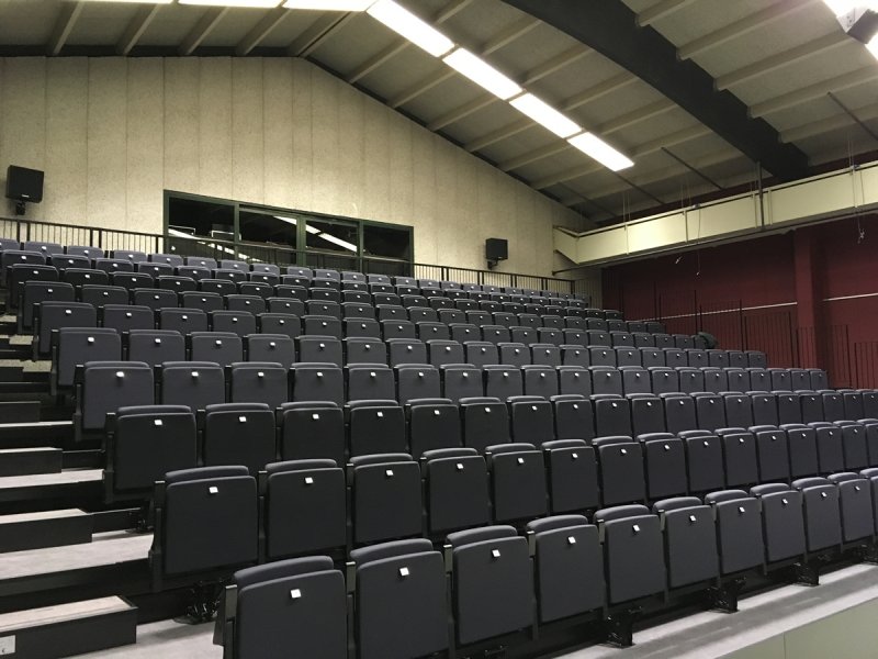 Telescopic grandstand, fully automatically operated chairs